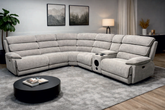 Gray sectional sofa in a living room setting with a coffee table and decor items.